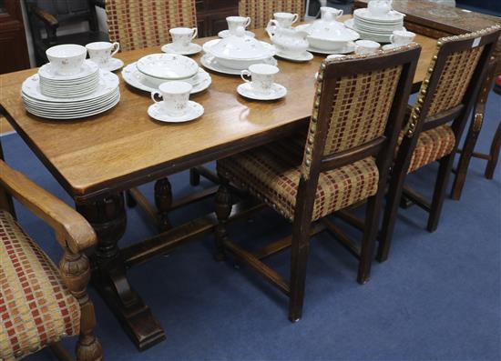 Oak refectory table on pineapple base supports and six chairs, W.183cm